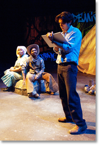 Juan José (René Millán) adds to his history book after meeting Viola and Ben Pettus (Kimberly Scott, Rodney Gardiner). Photo by Jenny Graham.