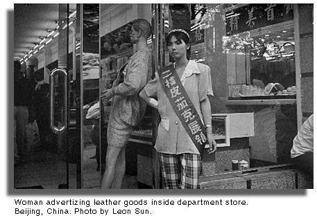 Woman advertizing leather goods. Beijing, China.