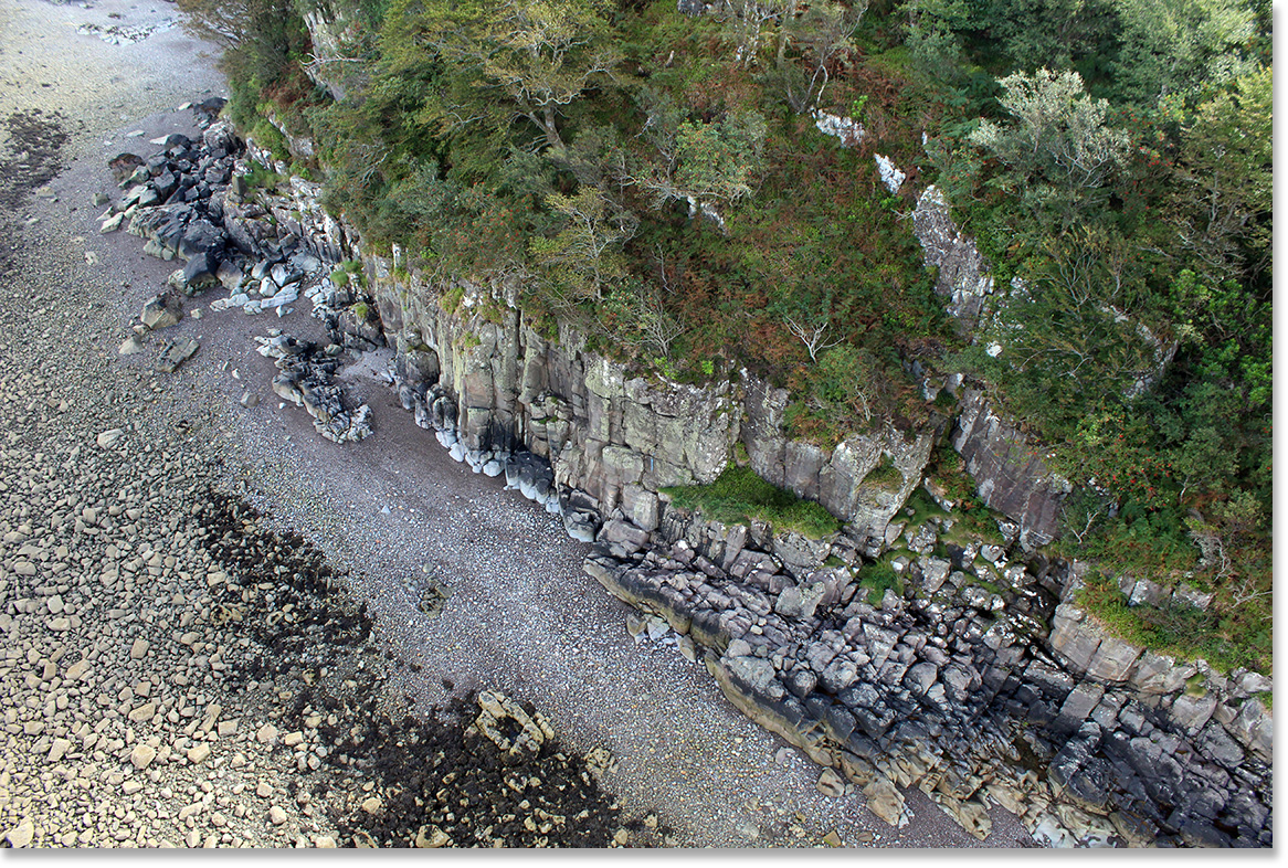 Looking down from Skye Bridge at cliffs and the beach. Isle of Skye, Scotland. Photo by Nic Paget-Clarke.