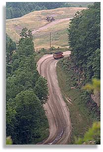 A truck hauls coal away.