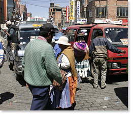 El Alto -- getting on and off colectivo mini-buses.