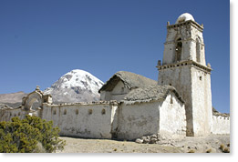 The 17th century church Comarapi Virgen Rosario and Mount Sajama in Caripe, Oruro department (altitude 15,000 feet). 
