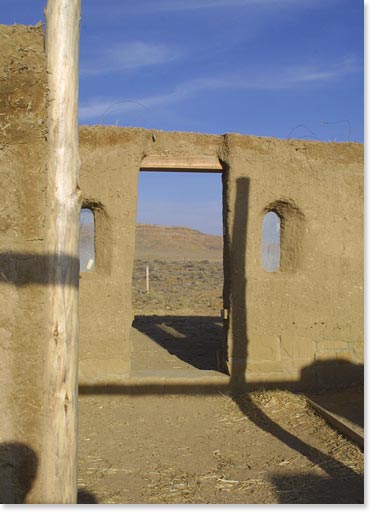 Looking out the door of cob house under construction in Kykotsmovi, Hopi Nation.