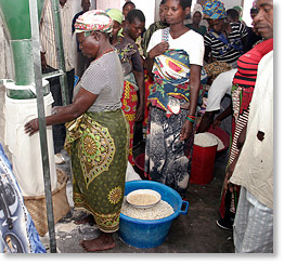 Community members use their milling machine in Meponda.