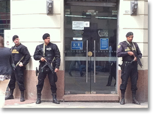  Between 2 and 3 pm, heavily-armed guards appear when banks send out the day's income. Montevideo, Uruguay.  Photo by Nic Paget-Clarke.