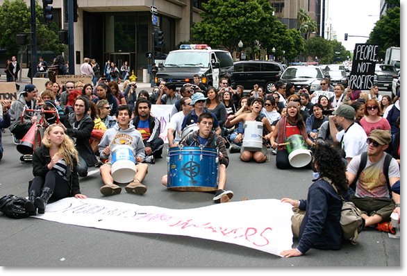 May Day 2012, San Diego, California. -- Students sit down and take the street for theirs in front of Bank of America and Wells Fargo. Photo by Nic Paget-Clarke.