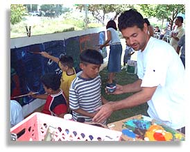 Jose Ramirez encouraging children to paint