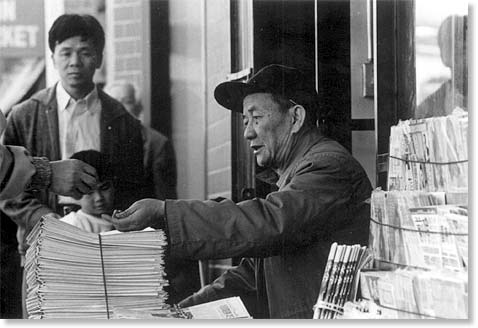 Newspaper vendor. Photo by Bruce Akizuki.