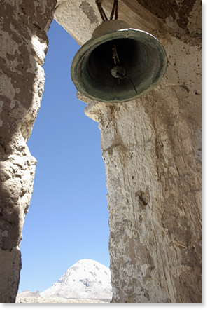 The bell tower in the courtyard of the 17th century church Comarapi Virgen Rosario and Mount Sajama, Oruro, Bolivia. Photo by Nic Paget-Clarke. 