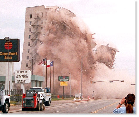 Demolishing the Buccaneer Hotel, Galveston seawall, Texas. The 11-storey building was "imploded" January 1, 1999 to make way for a park. Photo by Nic Paget-Clarke.