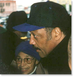 Rosa Parks and Rev. Jesse Jackson at the Save The Dream March, Los Angeles, February 23, 1998. Photo by Butch Wing.