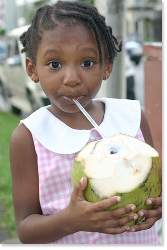 Sienna Lewis enjoys a refreshing coconut. Photo by Nic Paget-Clarke.